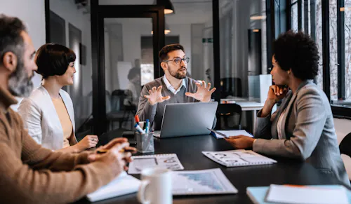 Tech coworkers in conference room