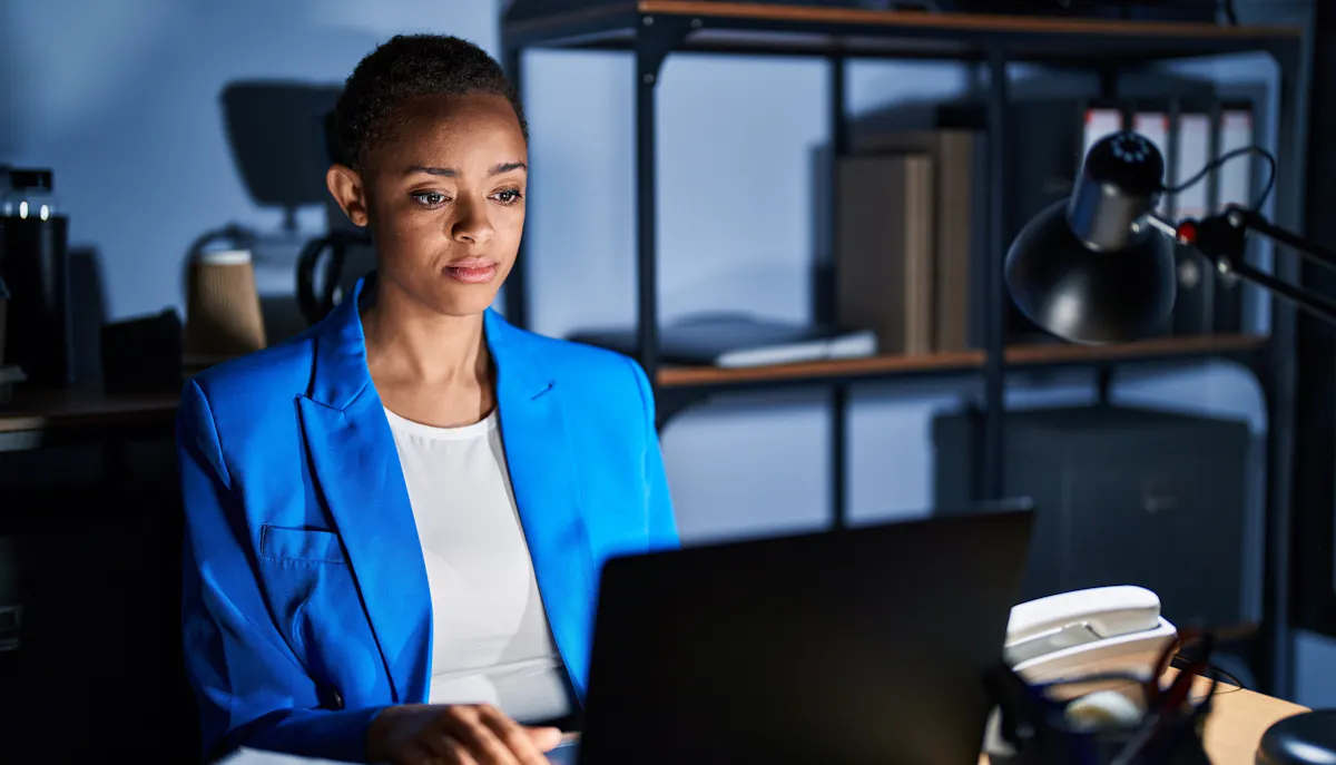 Woman working at desk in blue blazer
