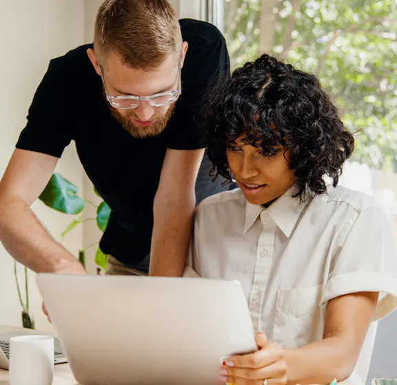 Man and woman looking at screen